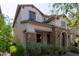 Two-story home with stone accents and a landscaped front yard at 10523 E Simone Ave, Mesa, AZ 85212