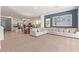 Spacious living room with open floor plan and large sofa at 10523 E Simone Ave, Mesa, AZ 85212