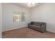 Bright office space with carpet flooring and a comfortable sofa at 10523 E Simone Ave, Mesa, AZ 85212