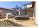 Backyard with trampoline and playhouse at 10523 E Simone Ave, Mesa, AZ 85212