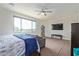 Bright main bedroom with large window and a comfy couch at 10523 E Simone Ave, Mesa, AZ 85212