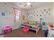 bedroom with a themed decor and plenty of storage at 10523 E Simone Ave, Mesa, AZ 85212