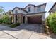Two-story house with stone accents and a large front yard at 10523 E Simone Ave, Mesa, AZ 85212