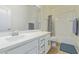 Clean bathroom with a double vanity, tub, and tile shower surround at 10523 E Simone Ave, Mesa, AZ 85212