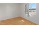 Small bedroom with light walls, wood flooring, and a window at 121 S Barkley --, Mesa, AZ 85204