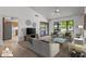Virtually staged living room with access to backyard at 12903 W Blue Sky Dr, Sun City West, AZ 85375