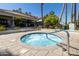Community hot tub surrounded by a tiled patio at 2057 E Marquette Dr, Gilbert, AZ 85234