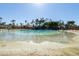 Expansive lagoon pool and sandy beach; refreshing oasis at 2057 E Marquette Dr, Gilbert, AZ 85234