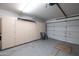 Two-car garage with built-in storage cabinets at 2057 E Marquette Dr, Gilbert, AZ 85234