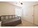 Cozy bedroom with daybed and built-in closet at 2057 E Marquette Dr, Gilbert, AZ 85234