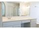 Bathroom features a vanity with large mirror and updated fixtures at 2057 E Marquette Dr, Gilbert, AZ 85234