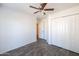 Bright bedroom with ceiling fan and double door closet at 2057 E Marquette Dr, Gilbert, AZ 85234