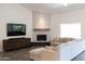 Spacious living room boasts a modern fireplace and large sectional sofa at 2057 E Marquette Dr, Gilbert, AZ 85234