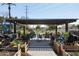 Relaxing community patio area with pergola and seating at 2057 E Marquette Dr, Gilbert, AZ 85234