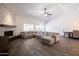 Open living space features a large sectional sofa and fireplace at 2057 E Marquette Dr, Gilbert, AZ 85234