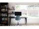 Home office features a large window, built-in shelving, and a workspace at 2057 E Marquette Dr, Gilbert, AZ 85234