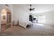 Bright main bedroom with carpeted floors and en-suite bathroom at 2057 E Marquette Dr, Gilbert, AZ 85234