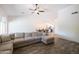 Living area with large sectional sofa and view into dining area at 2057 E Marquette Dr, Gilbert, AZ 85234