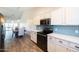 Kitchen features stainless steel appliances and light blue tile backsplash at 2057 E Marquette Dr, Gilbert, AZ 85234