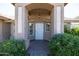 Covered entryway with decorative columns and door at 2057 E Marquette Dr, Gilbert, AZ 85234