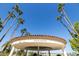 Circular patio with palm trees and seating, perfect for relaxing at 2057 E Marquette Dr, Gilbert, AZ 85234