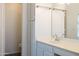 Bathroom with single sink vanity, linen closet, and toilet at 2057 E Marquette Dr, Gilbert, AZ 85234