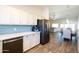 Kitchen with stainless steel appliances and view into dining area at 2057 E Marquette Dr, Gilbert, AZ 85234