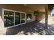 Covered patio with sliding glass doors leading to the backyard at 2057 E Marquette Dr, Gilbert, AZ 85234