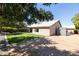 Large backyard, grassy area, shed, and patio furniture at 2057 E Marquette Dr, Gilbert, AZ 85234