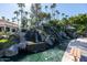 Serene waterfall feature with walking path; beautiful landscaping at 2057 E Marquette Dr, Gilbert, AZ 85234