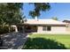 House exterior showcasing backyard, patio, and mature trees at 2057 E Marquette Dr, Gilbert, AZ 85234