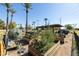 Community garden with raised beds, shaded seating, and composting bins at 2057 E Marquette Dr, Gilbert, AZ 85234