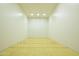 Indoor racquetball court with hardwood floor and white walls at 2057 E Marquette Dr, Gilbert, AZ 85234