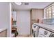 Laundry room with washer, dryer, and extra storage at 6802 E Paradise Pkwy, Scottsdale, AZ 85251