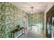 Entryway with tropical print wallpaper and a console table at 6802 E Paradise Pkwy, Scottsdale, AZ 85251