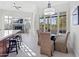 Bright dining area with glass table and view to backyard at 12028 N 80Th Pl, Scottsdale, AZ 85260