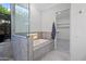 Bathroom features a soaking tub, walk-in shower, and a large closet at 12028 N 80Th Pl, Scottsdale, AZ 85260