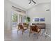 Open concept living room with high ceilings, access to patio and pool view at 12028 N 80Th Pl, Scottsdale, AZ 85260