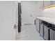 Bright laundry room with washer, dryer, and counter space at 12028 N 80Th Pl, Scottsdale, AZ 85260