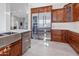Kitchen boasts stainless steel appliances and custom cabinetry at 12028 N 80Th Pl, Scottsdale, AZ 85260