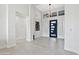 Bright and spacious entryway with high ceilings and modern light fixture at 12028 N 80Th Pl, Scottsdale, AZ 85260