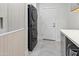 Laundry room with stackable washer and dryer, and ample counter space at 12028 N 80Th Pl, Scottsdale, AZ 85260