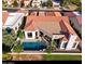 Aerial view of home with red tile roof and private pool at 12028 N 80Th Pl, Scottsdale, AZ 85260