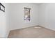 Bright bedroom with neutral carpeting and a window with a view at 11856 W Lone Tree Trl, Peoria, AZ 85383