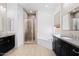 Elegant bathroom with double vanity and soaking tub at 11856 W Lone Tree Trl, Peoria, AZ 85383