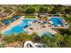 Community pool with water slides and lounge areas at 11856 W Lone Tree Trl, Peoria, AZ 85383