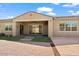 Home exterior showcasing a covered patio and landscaped yard at 11856 W Lone Tree Trl, Peoria, AZ 85383