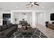 Living room features a comfortable sofa and coffee table, open floor plan at 11856 W Lone Tree Trl, Peoria, AZ 85383