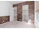 Bedroom with wood-like accent wall and spacious closet at 11856 W Lone Tree Trl, Peoria, AZ 85383