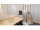 Clean bathroom with a round mirror, shower, and toilet at 2477 E Glenhaven Dr, Phoenix, AZ 85048